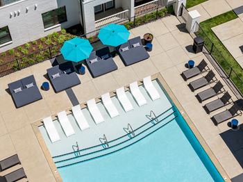 Resort-style pool with tanning ledge and sundeck